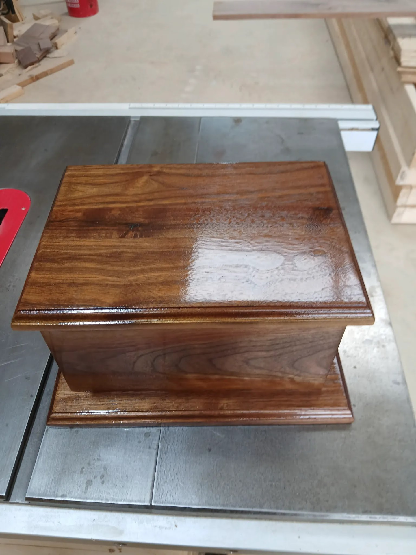 Closed black walnut keepsake box with moulded lid and base